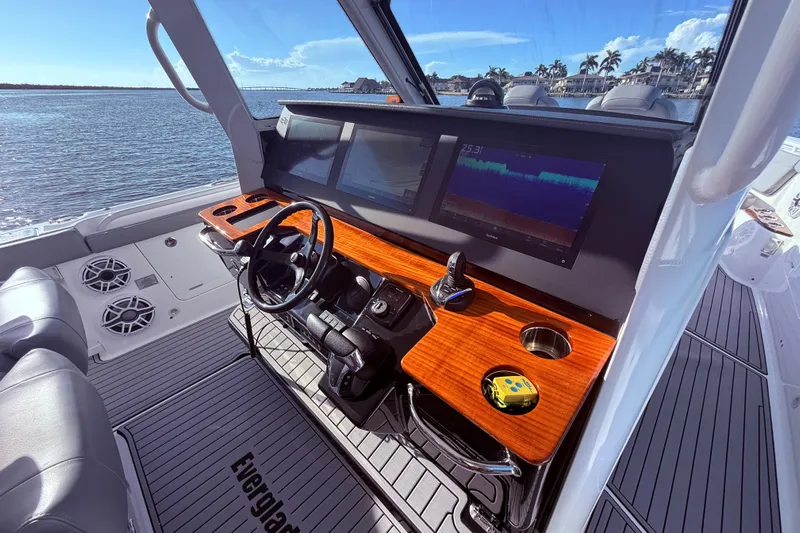  Yacht Photos Pics 2023 Everglades 395 Center Console boat interior with modern dashboard and steering wheel.
