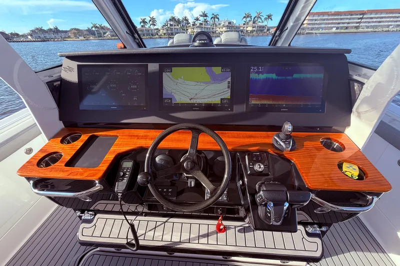  Yacht Photos Pics 2023 Everglades 395 Center Console helm with advanced navigation displays and controls.