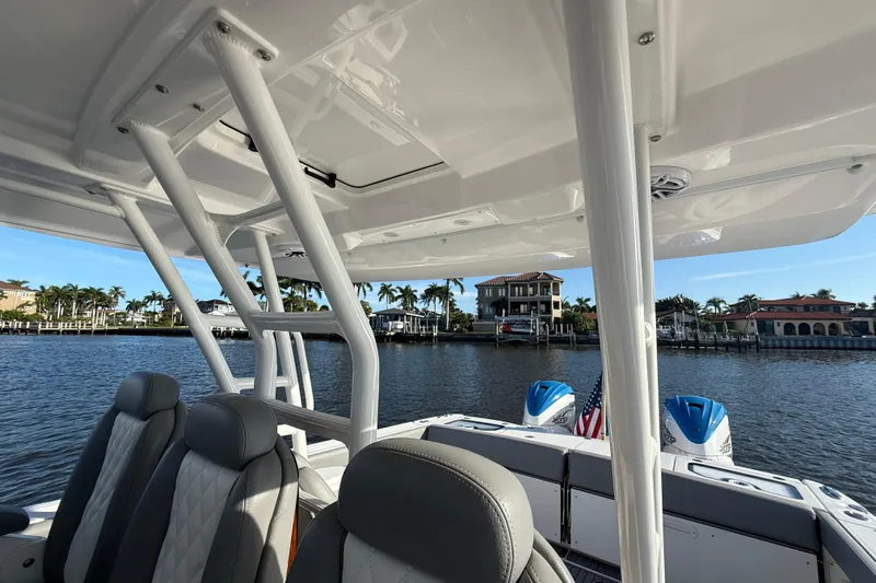  Yacht Photos Pics 2023 Everglades 395 Center Console boat interior with waterfront view.