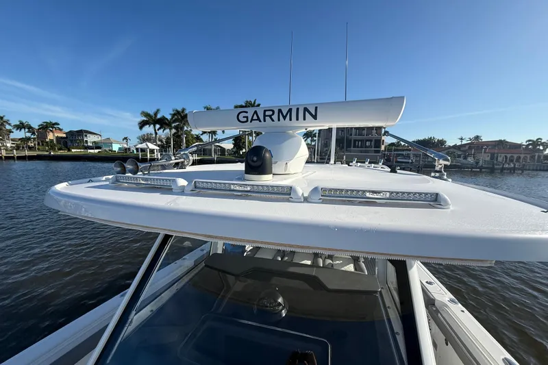  Yacht Photos Pics 2023 Everglades 395 Center Console boat with Garmin radar on calm water.