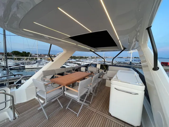 Bazinga Yacht Photos Pics Luxurious 2023 Prestige 690 yacht deck with elegant seating and modern lighting.