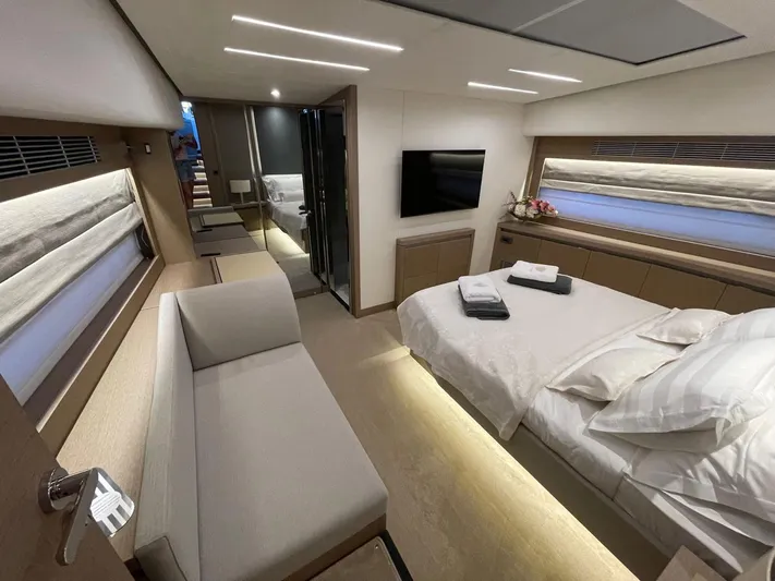 Bazinga Yacht Photos Pics Luxurious interior of 2023 Prestige 690 yacht with modern bedroom and elegant furnishings.