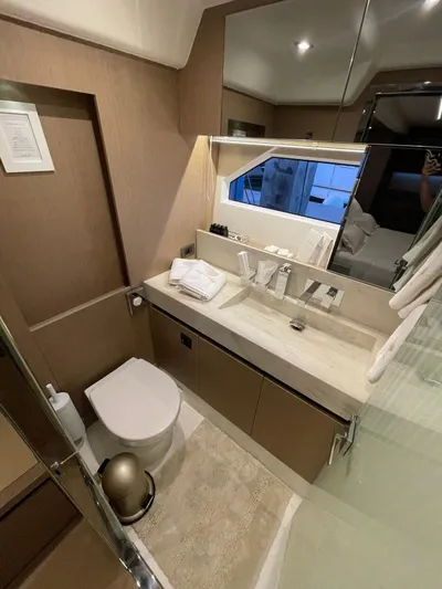 Bazinga Yacht Photos Pics Luxury bathroom in 2023 Prestige 690 yacht with modern fixtures and elegant design.