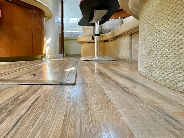 Seaswing Yacht Photos Pics Interior of 2002 Sea Ray 380 Sundancer with wooden flooring and seating area.