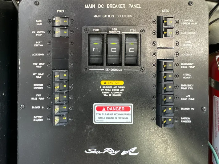 Seaswing Yacht Photos Pics Main DC breaker panel of 2002 Sea Ray 380 Sundancer boat with labeled switches and safety warnings.
