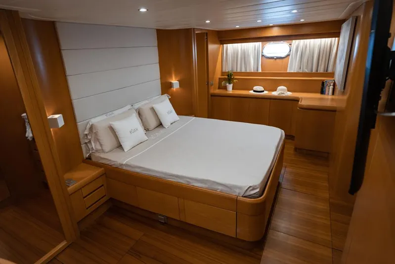  Yacht Photos Pics Luxurious cabin interior of 2005 Diano 24 yacht with wooden furnishings and cozy bed.