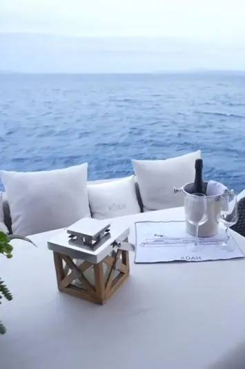  Yacht Photos Pics Luxury yacht deck with ocean view, featuring champagne and elegant decor. Diano 24, 2005 model.