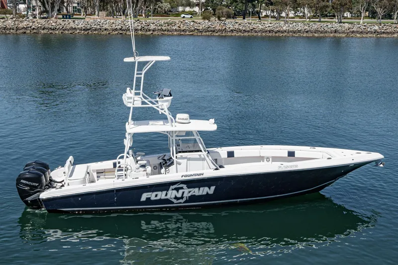 Go Time Yacht Photos Pics 2019 Fountain 38 CC boat on calm water, featuring dual Mercury engines.