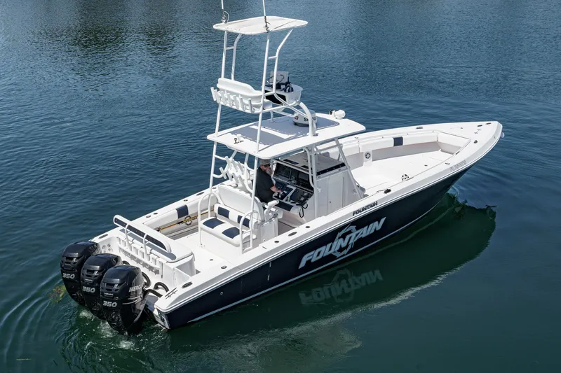 Go Time Yacht Photos Pics 2019 Fountain 38 CC boat with triple Mercury engines on calm water.