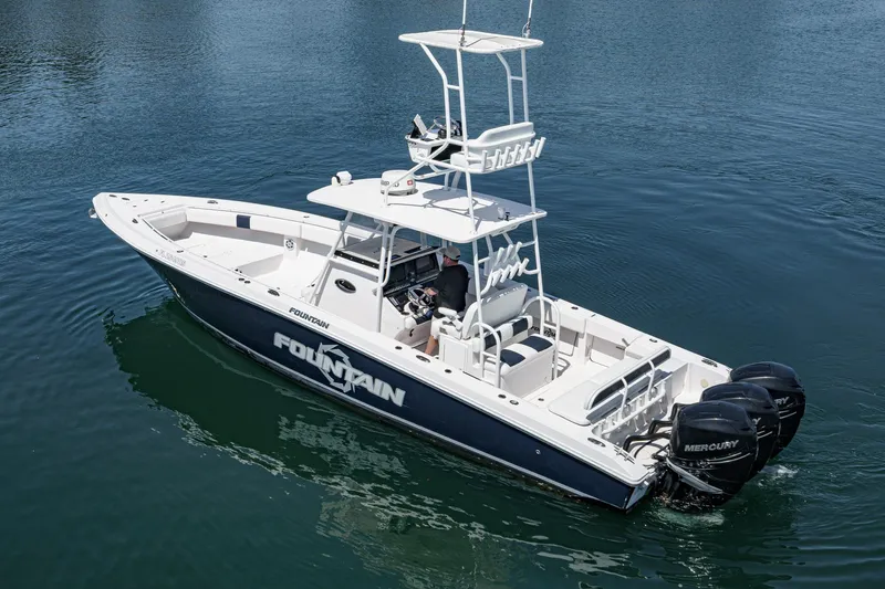 Go Time Yacht Photos Pics 2019 Fountain 38 CC boat with triple Mercury engines on calm water.