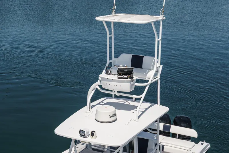 Go Time Yacht Photos Pics 2019 Fountain 38 CC boat with elevated helm station on calm water.