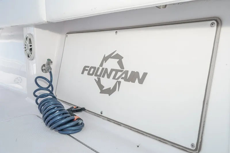 Go Time Yacht Photos Pics 2019 Fountain 38 CC boat interior with coiled hose and logo.