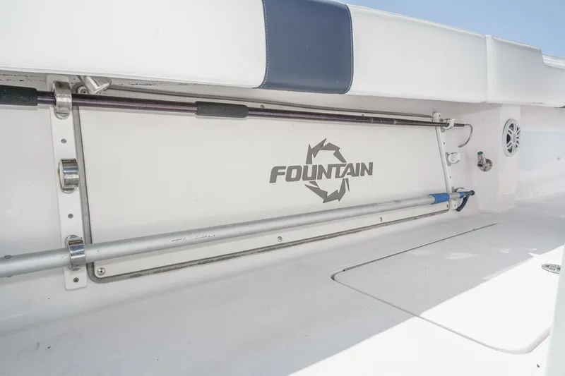 Go Time Yacht Photos Pics 2019 Fountain 38 CC boat interior with rod holders and logo.