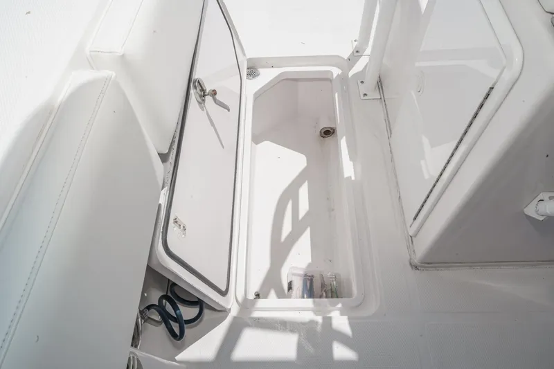 Go Time Yacht Photos Pics Open storage compartment on 2019 Fountain 38 CC boat deck.