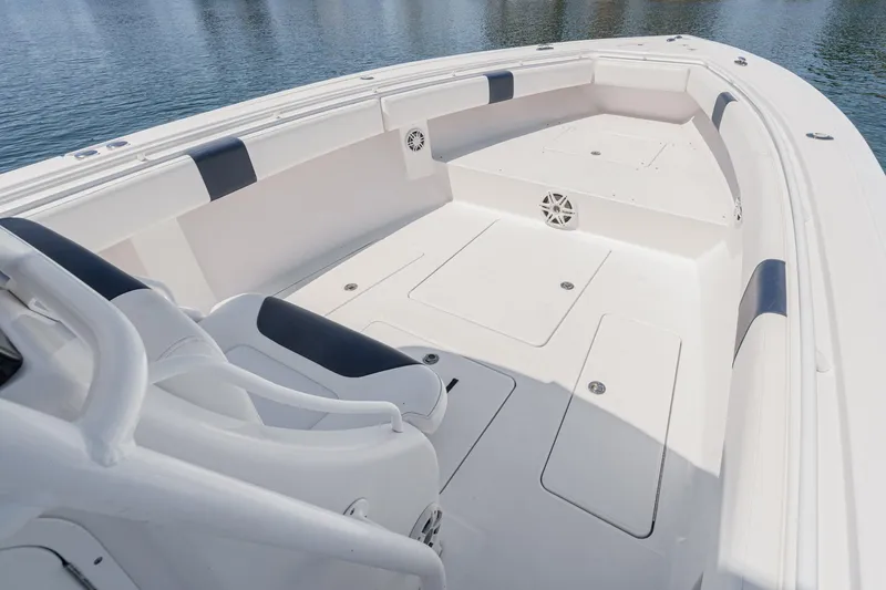 Go Time Yacht Photos Pics 2019 Fountain 38 CC boat interior with white seating and storage compartments.