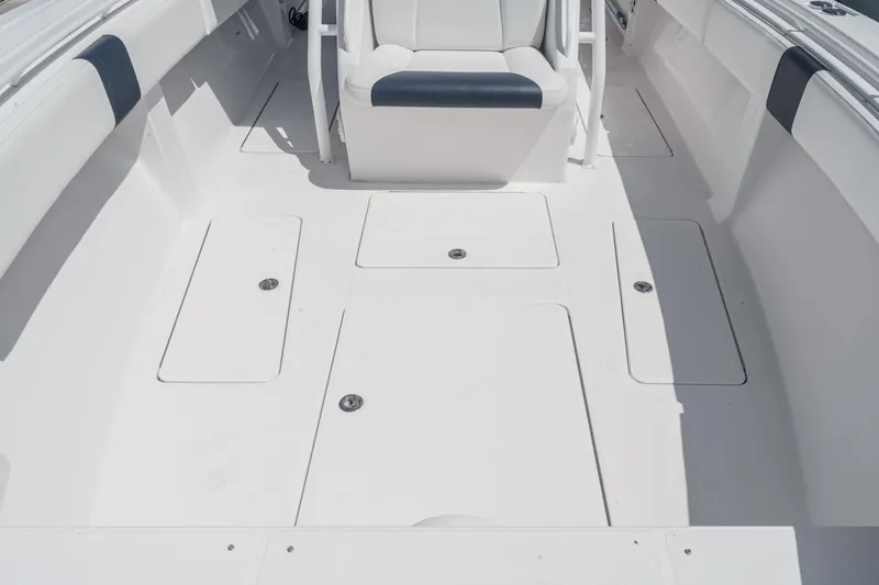 Go Time Yacht Photos Pics 2019 Fountain 38 CC boat interior with white seating and storage compartments.