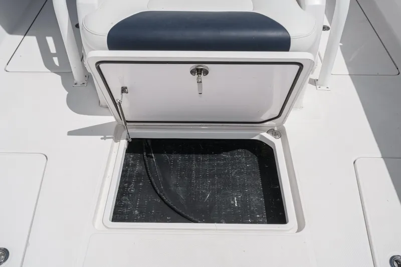 Go Time Yacht Photos Pics 2019 Fountain 38 CC boat storage compartment with open hatch.