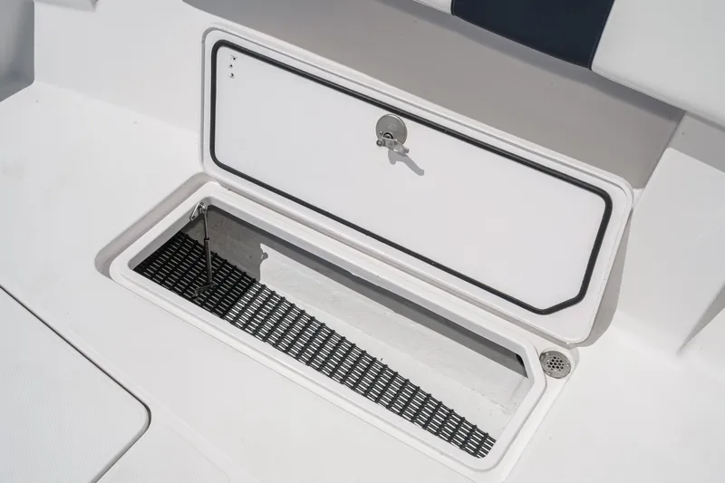 Go Time Yacht Photos Pics Storage compartment on a 2019 Fountain 38 CC boat, featuring a secure latch.