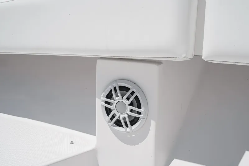Go Time Yacht Photos Pics Speaker on 2019 Fountain 38 CC boat, integrated into white seating area.