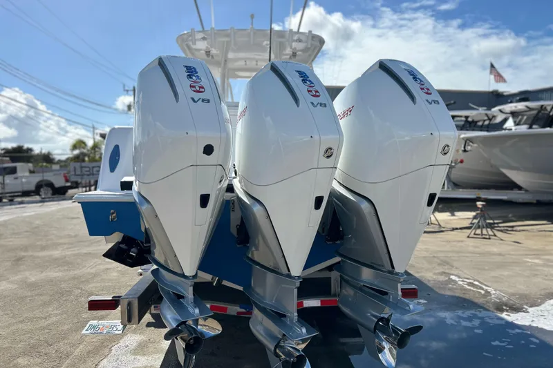  Yacht Photos Pics 2025 Contender 35 ST boat with triple V8 outboard engines on a sunny day.