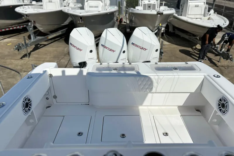  Yacht Photos Pics 2025 Contender 35 ST boat with triple Mercury engines, docked in a marina.