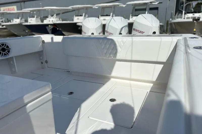  Yacht Photos Pics 2025 Contender 35 ST boat interior with Mercury engines, showcasing sleek seating and storage.