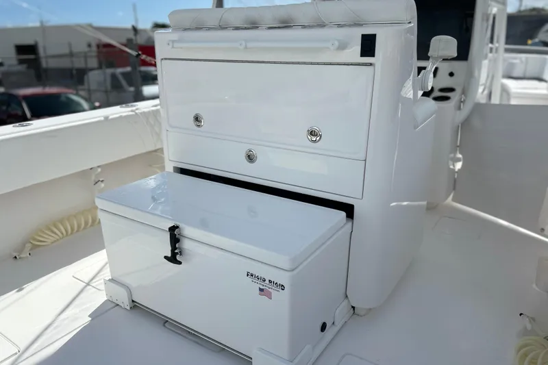  Yacht Photos Pics 2025 Contender 35 ST boat interior with storage compartments and cooler.