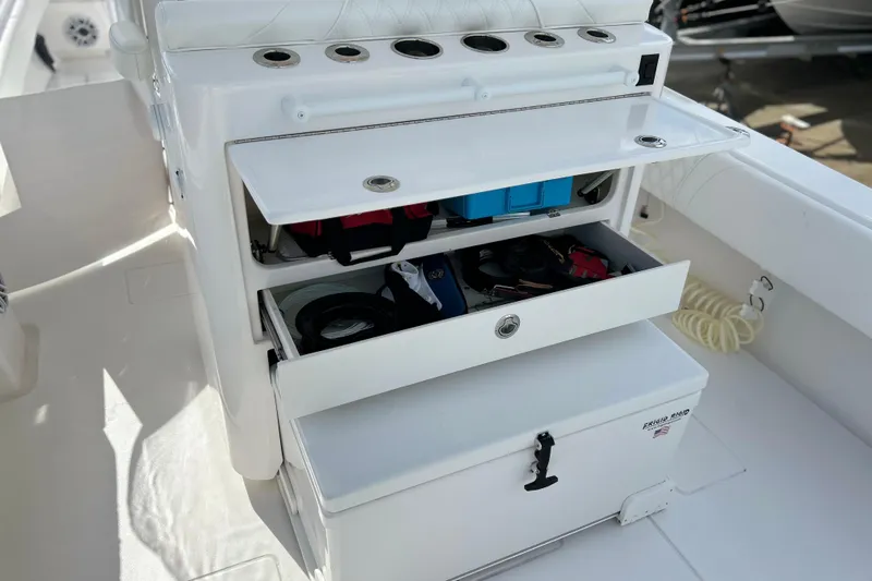 Yacht Photos Pics 2025 Contender 35 ST boat storage compartments with fishing gear and accessories.