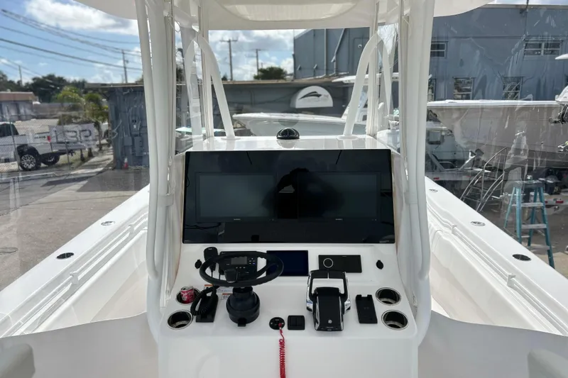  Yacht Photos Pics 2025 Contender 35 ST boat cockpit with modern steering and navigation system.