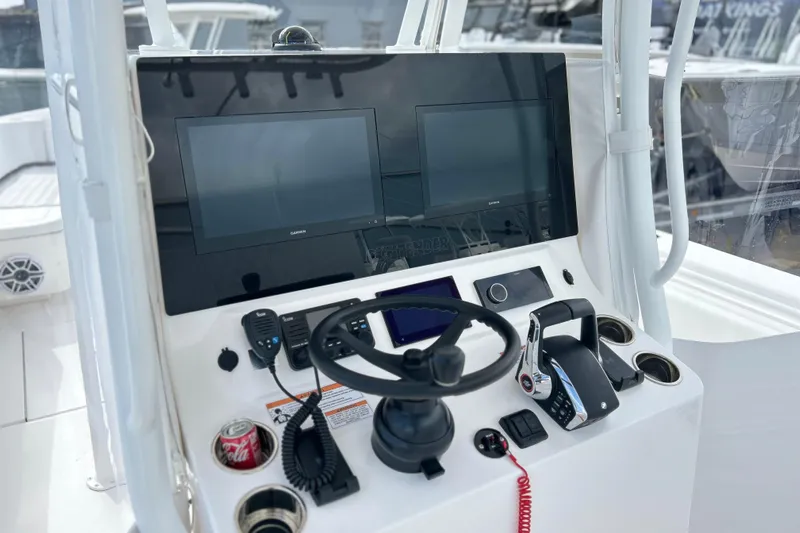  Yacht Photos Pics 2025 Contender 35 ST boat helm with dual screens and steering wheel.
