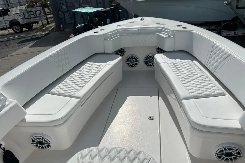  Yacht Photos Pics Luxurious seating area on a 2025 Contender 35 ST boat with white upholstery and speakers.