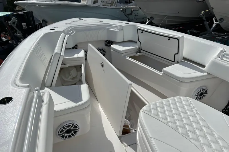  Yacht Photos Pics 2025 Contender 35 ST boat interior with white seating and storage compartments.