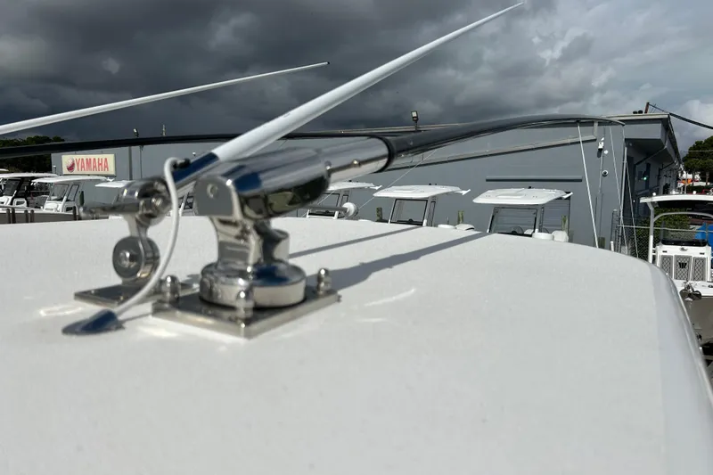  Yacht Photos Pics 2025 Contender 35 ST boat with antenna, Yamaha sign in background.