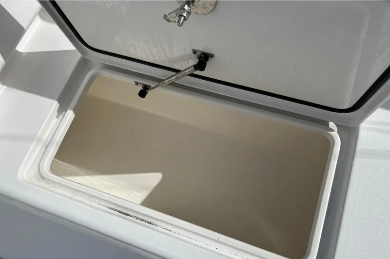  Yacht Photos Pics Open storage compartment on 2025 Contender 35 ST boat, showcasing interior space.