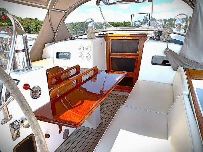 Alice Yacht Photos Pics 1983 Little Harbor 44 yacht interior with polished wood and white seating.