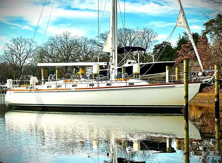 Alice Yacht Photos Pics 1983 Little Harbor 44 sailboat docked on a calm, reflective waterway.