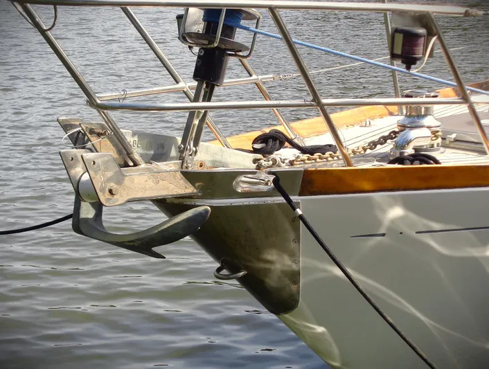 Alice Yacht Photos Pics Little Harbor 44 sailboat bow with anchor, 1983 model, on calm water.
