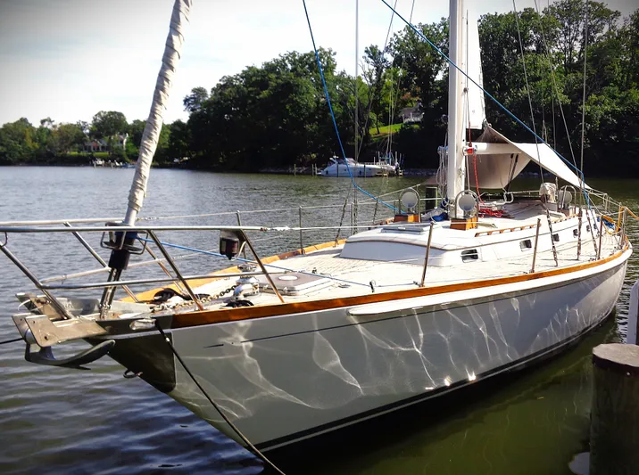 Alice Yacht Photos Pics 1983 Little Harbor 44 sailboat docked on a serene lake.