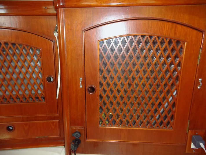Alice Yacht Photos Pics Wooden cabinet doors with lattice design on a 1983 Little Harbor 44 yacht.