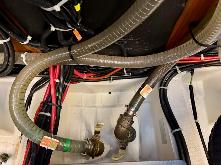 Freedom Yacht Photos Pics Engine room of 2022 Beneteau Swift Trawler 41 Fly with hoses and wiring.