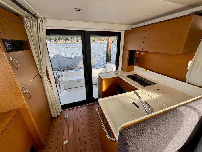 Freedom Yacht Photos Pics Interior of 2022 Beneteau Swift Trawler 41 Fly, featuring modern kitchen and water view.