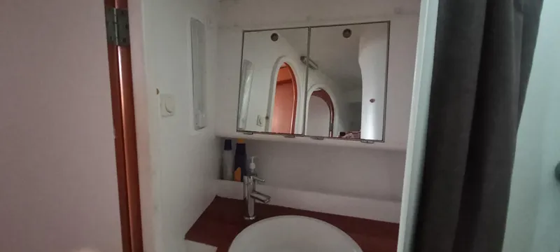 Oya Yacht Photos Pics Bathroom interior of 1989 Van De Stadt 52 yacht with mirror and sink.