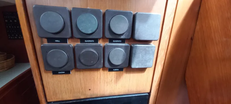 Oya Yacht Photos Pics Control panel on a 1989 Van De Stadt 52 yacht with labeled switches.