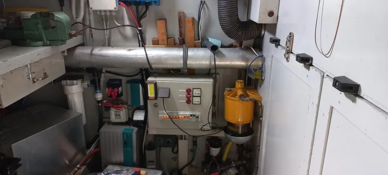 Oya Yacht Photos Pics Engine room of a 1989 Van De Stadt 52 yacht with various mechanical components.