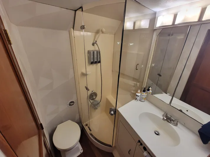  Yacht Photos Pics Bathroom of a 1991 Ocean Yachts 42 Super Sport with shower, sink, and toilet.