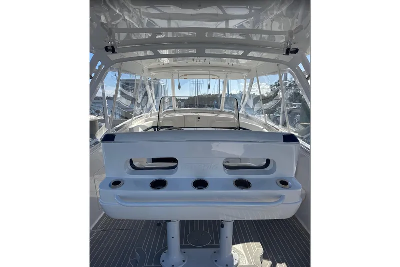  Yacht Photos Pics 2015 Intrepid 400 Cuddy interior with seating and rod holders, showcasing sleek design.