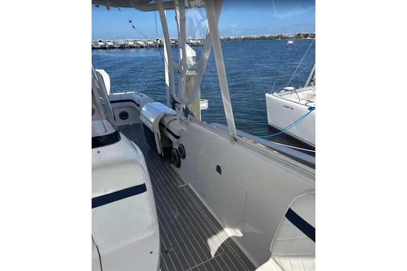  Yacht Photos Pics 2015 Intrepid 400 Cuddy boat interior with sleek design, docked by the water.