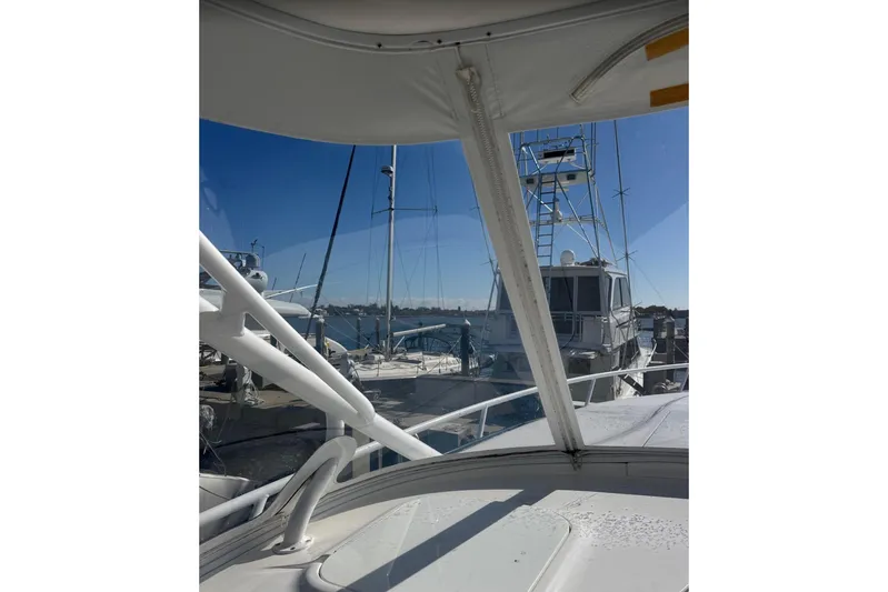  Yacht Photos Pics 2015 Intrepid 400 Cuddy yacht docked at marina, clear blue sky background.
