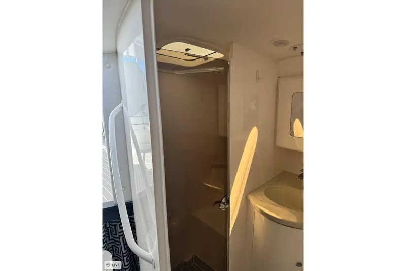  Yacht Photos Pics 2015 Intrepid 400 Cuddy interior bathroom with sink and shower.
