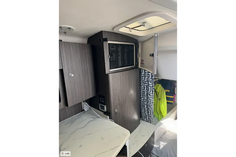  Yacht Photos Pics Interior of 2015 Intrepid 400 Cuddy with modern cabinetry and control panel.